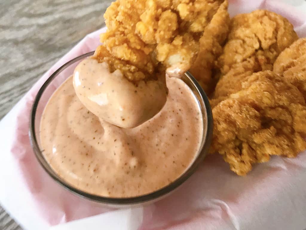 chicken dipped in Raising Cane's Sauce sauce