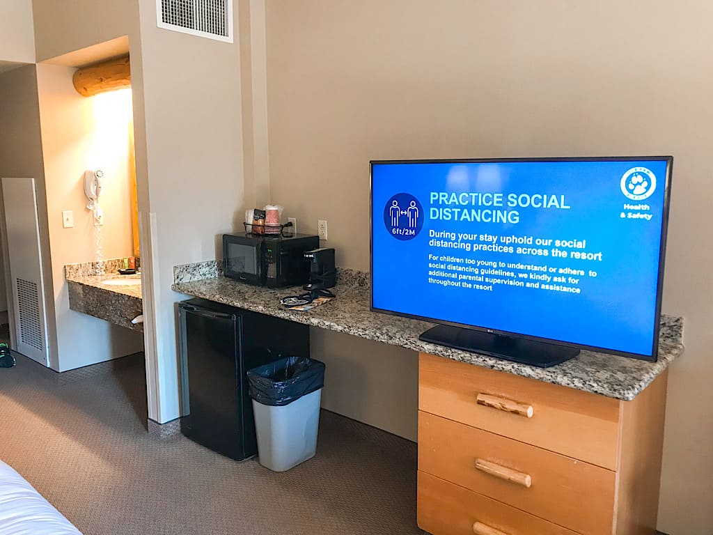 TV, microwave, and mini fridge in a suite at Great Wolf Lodge