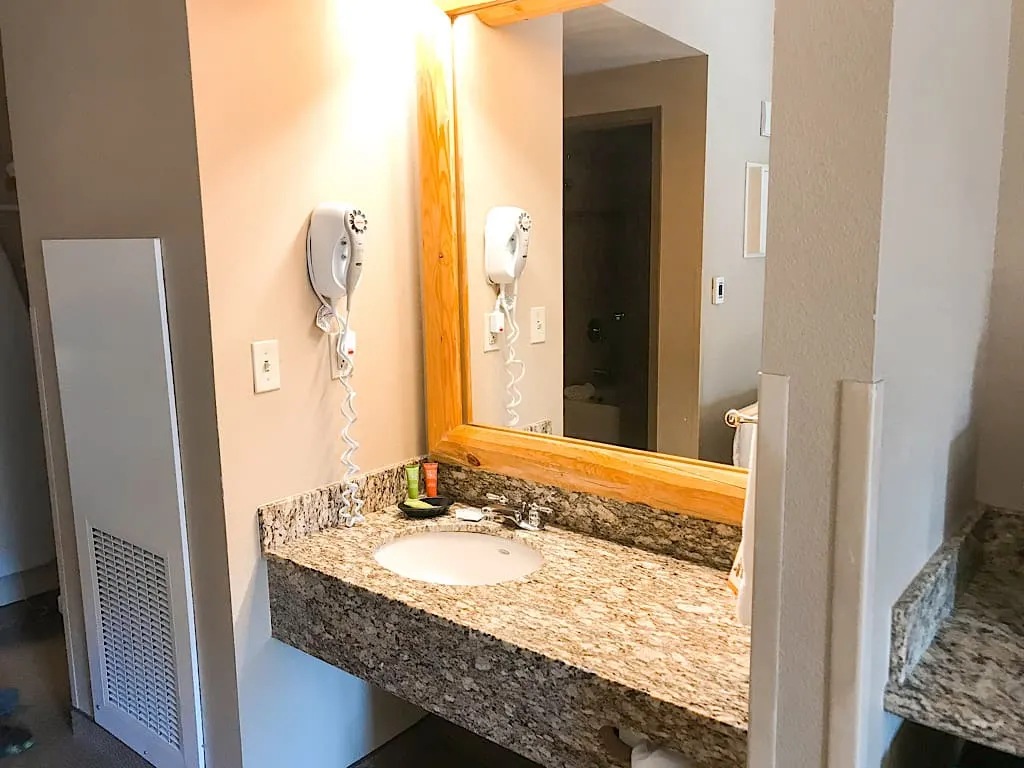 Sink and mirror in main room of Grand Bear Suite at Great Wolf Lodge