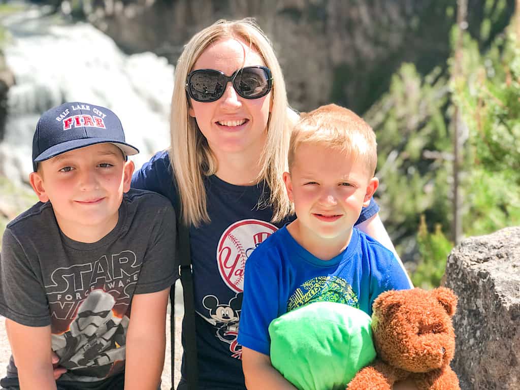 A mom and two kids at Gibbon Falls in Yellowstone National Park