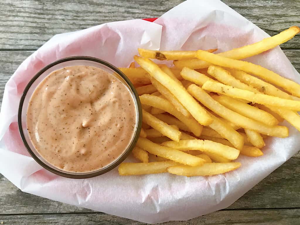 Raising Cane's Sauce and a basket of fries