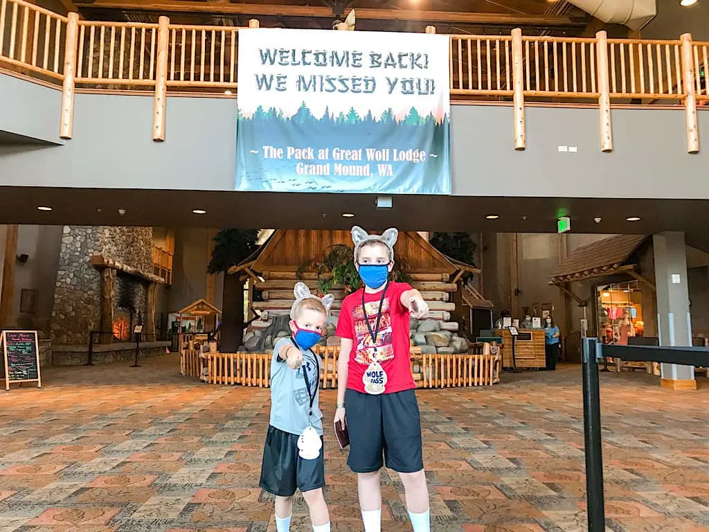 Two kids in the lobby of Great Wolf Lodge Washington
