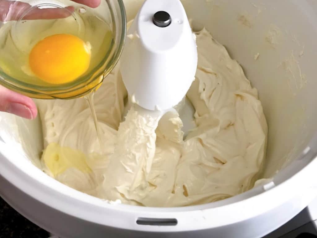 Add the eggs, one at a time, and beat the mixture for about 1 minute after each.