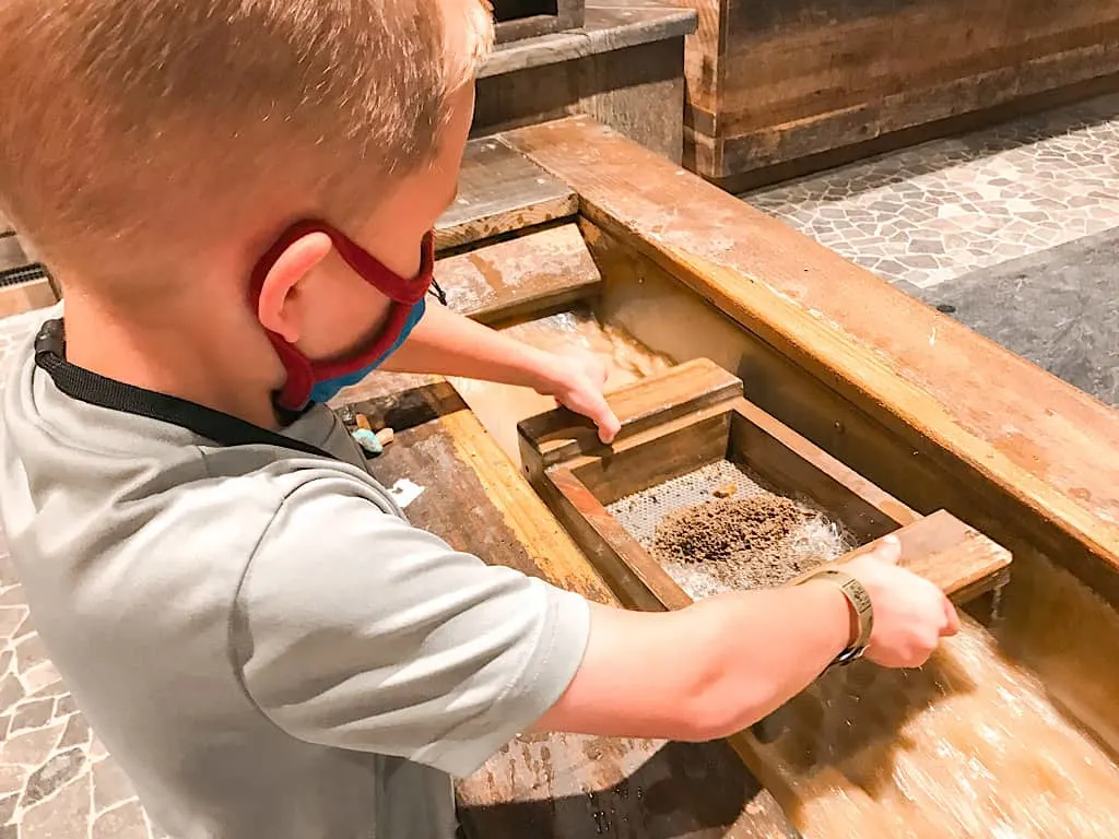 A boy panning for gems at Great Wolf Lodge