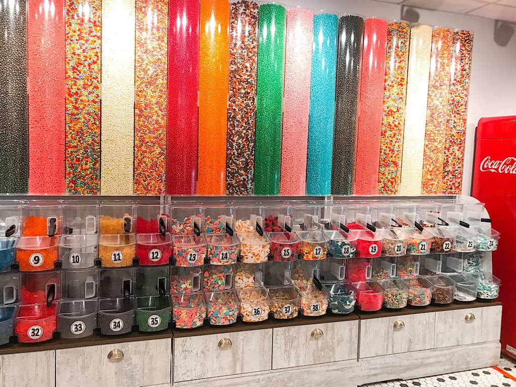 A wall of colorful bulk candy in the Great Wolf Candy Store