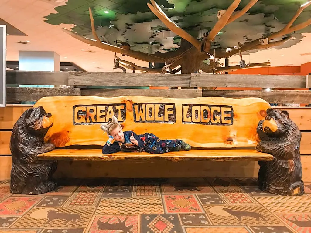 A child on a Great Wolf Lodge bench