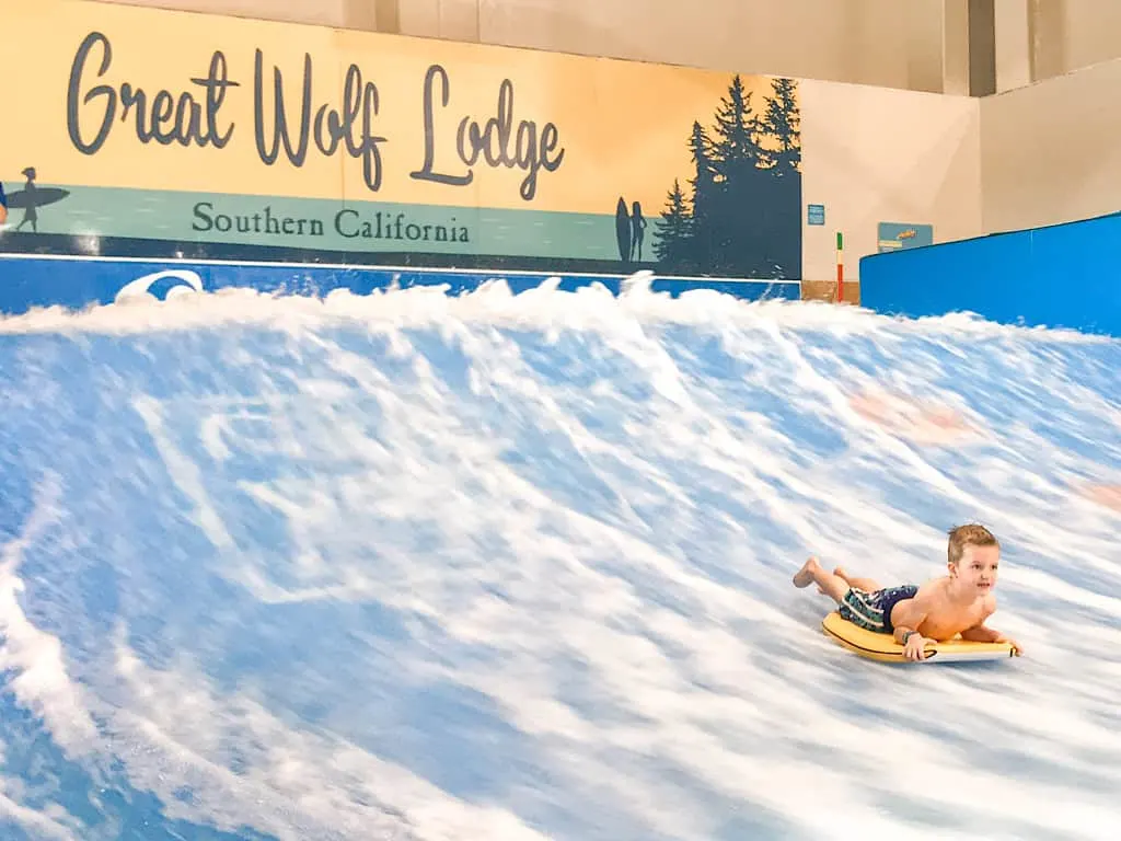 A boy doing tricks on a flow rider at Great Wolf Lodge Garden Grove