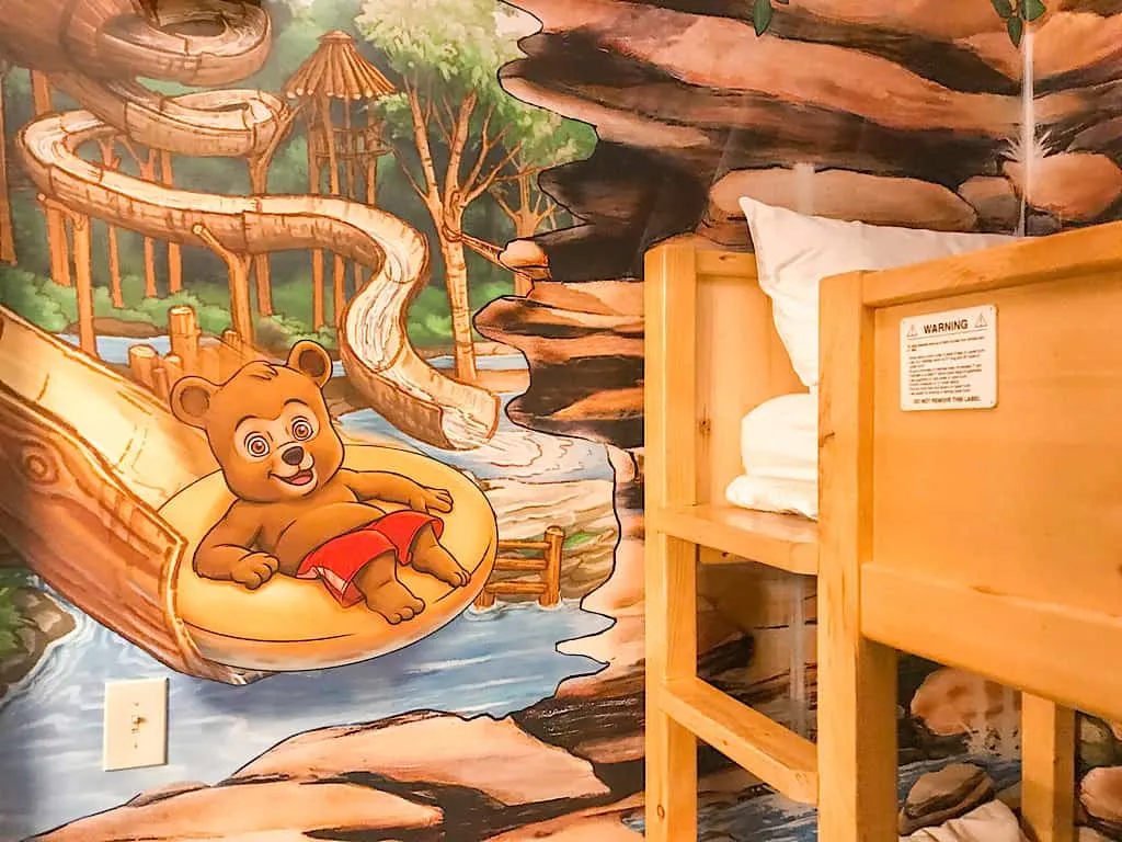 Bunk beds and mural in Wolf Den Suite