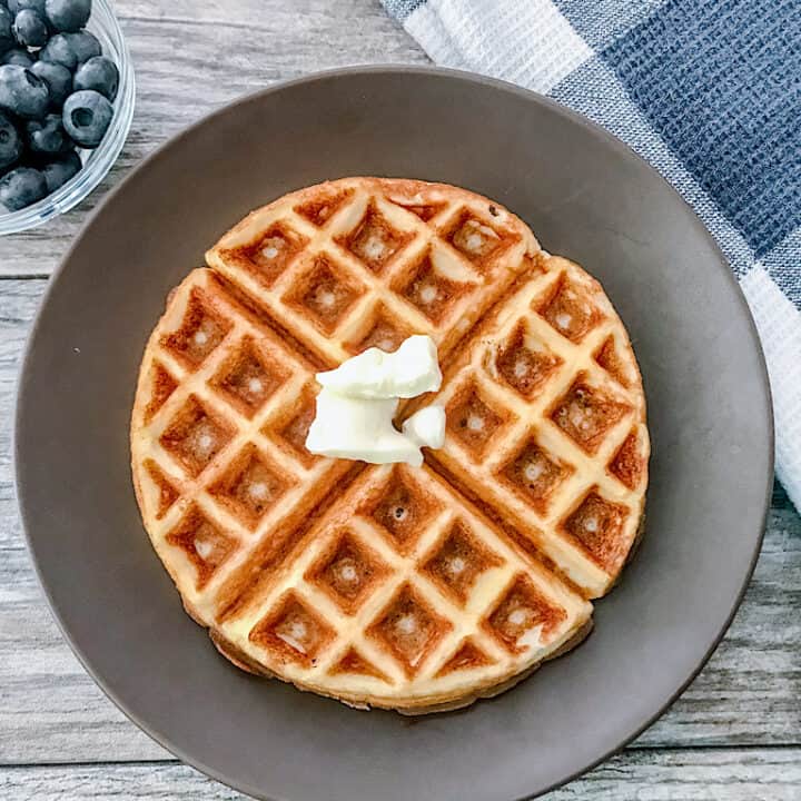 A low carb waffle with a side of blueberries