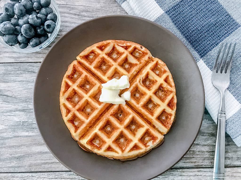 A low carb waffle with a side of blueberries