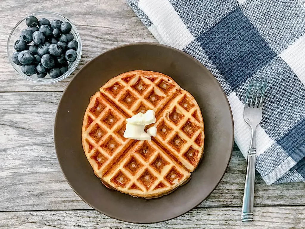 Remove the waffle from the iron and serve with your favorite <a href=