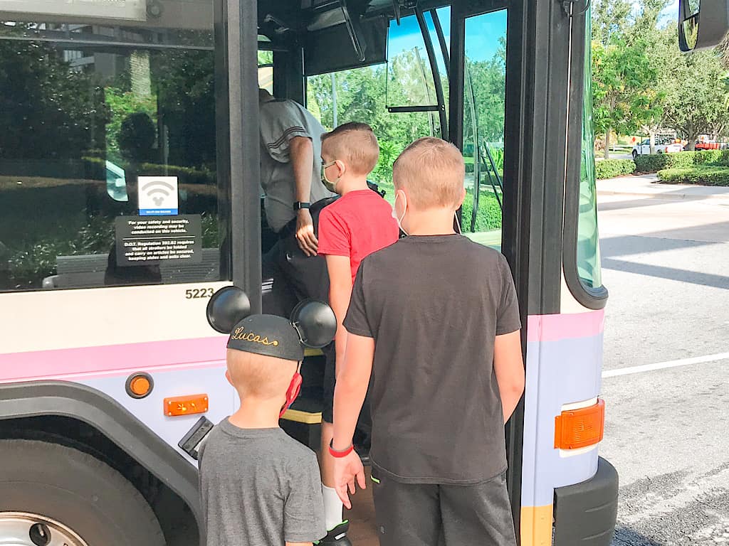 A family getting on a Disney World Transportation Bus at Contemporary Resort