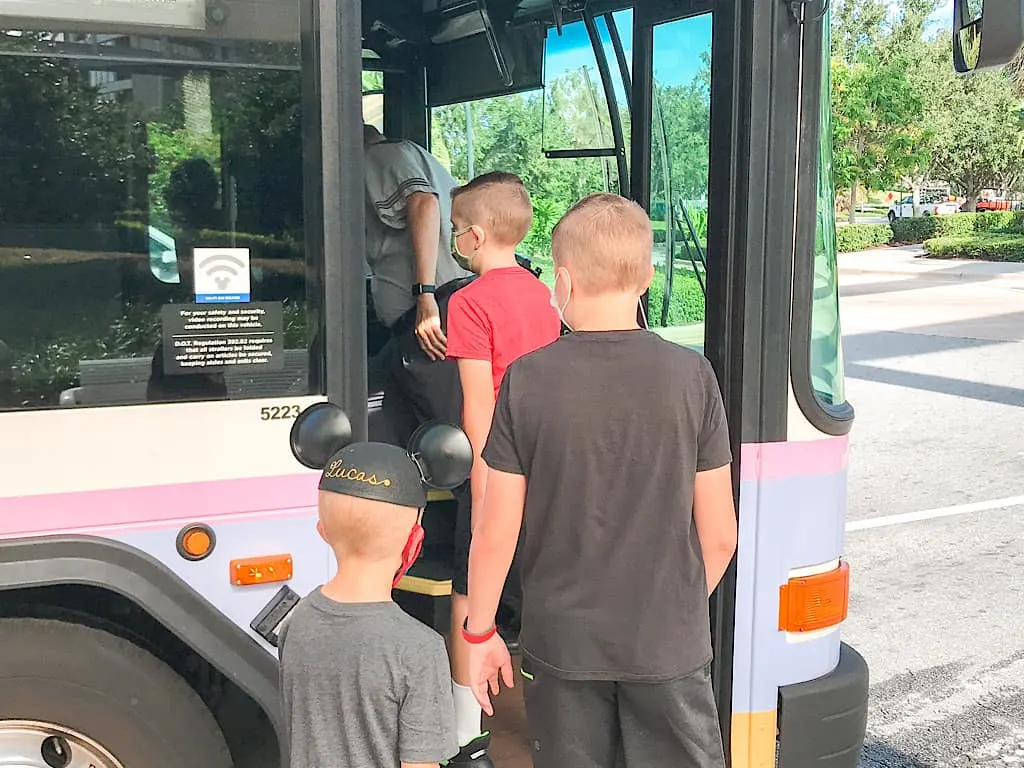 A family getting on a Disney World Transportation Bus at Contemporary Resort