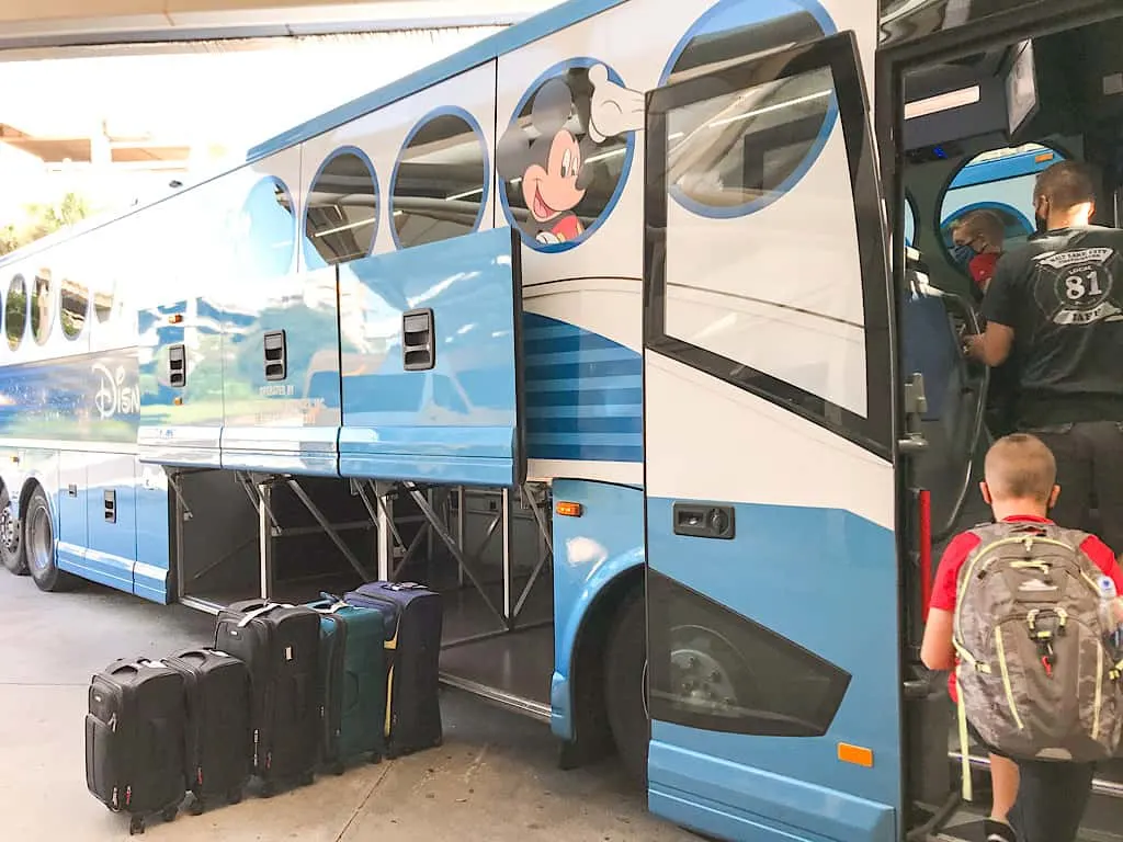 A child getting on Disney's Magical Express Bus on the way to Contemporary Resort