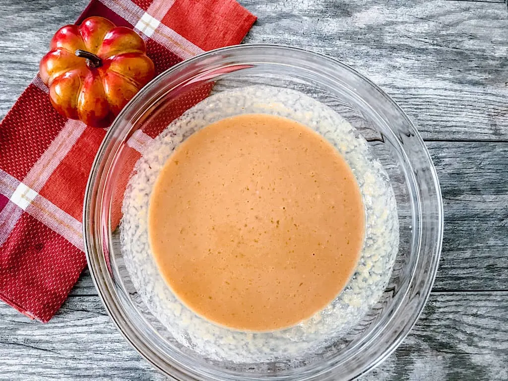 In a separate bowl, whisk together the eggs, brown sugar, pumpkin purée, milk, butter, and vanilla extract.