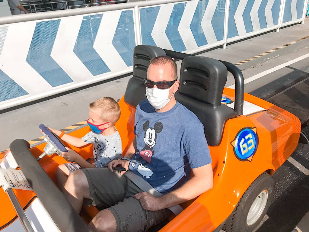 Disney World guests riding Tomorrowland Speedway