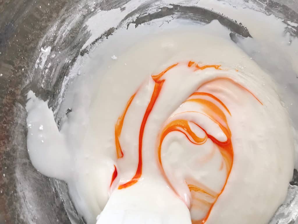 orange food coloring in sugar cookie icing