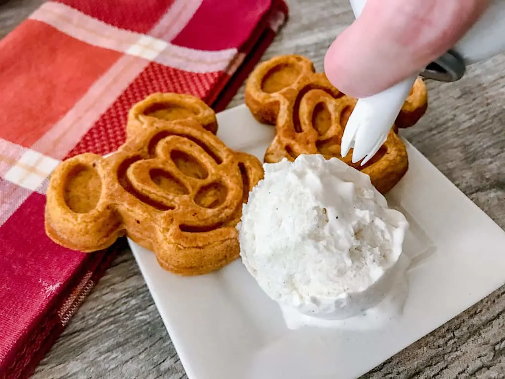 Swirl whipped cream on top of the ice cream