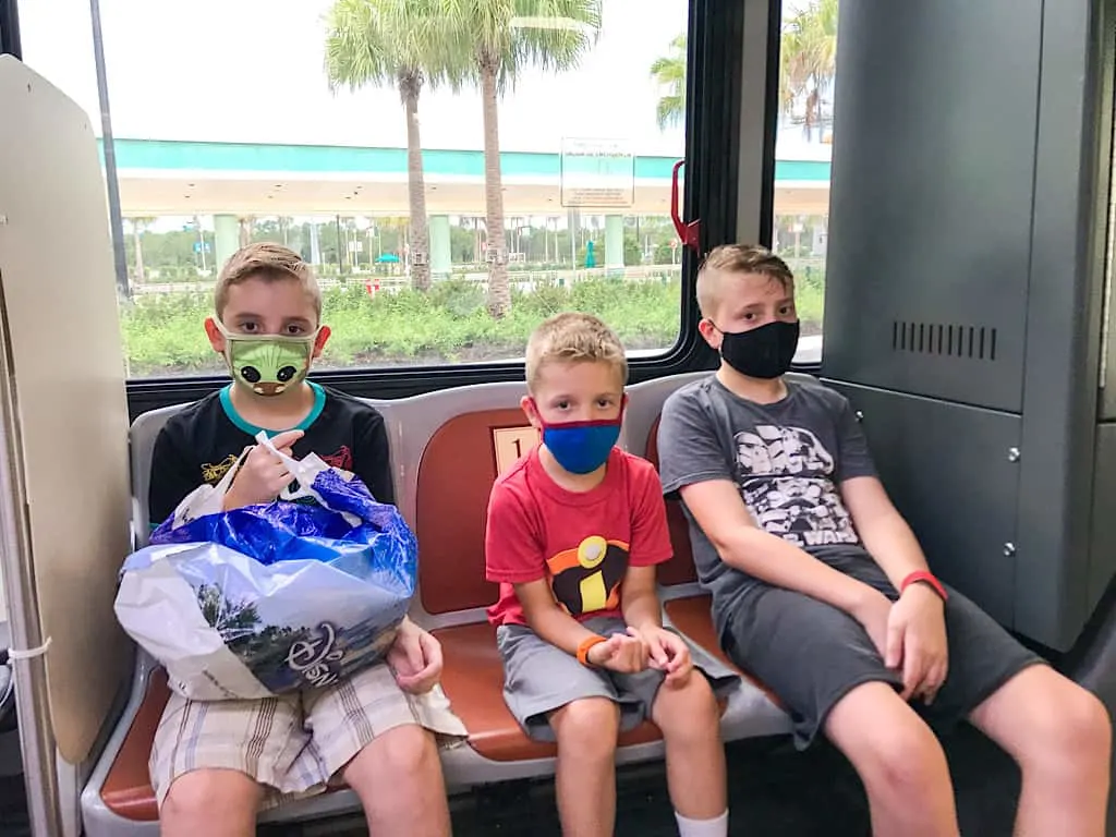 Kids riding Disney Transportation bus