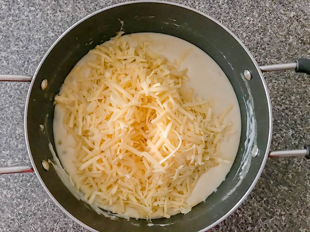 Remove the soup from heat and add the Tobasco, Worcestershire, and Sharp White Cheddar. Stir until the cheese is melted. (If you want a smoother soup, use an immersion blender at this point)