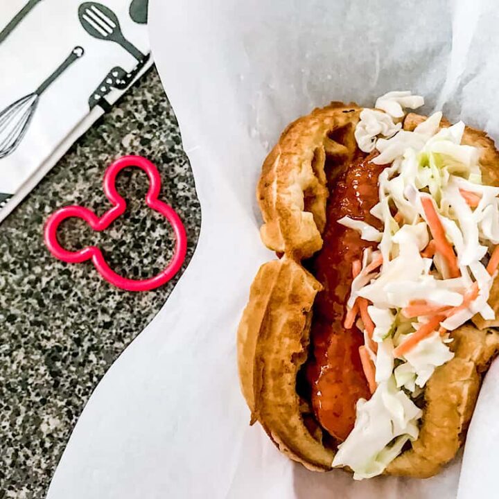 A waffle sandwich with sweet & spicy chicken and cole slaw