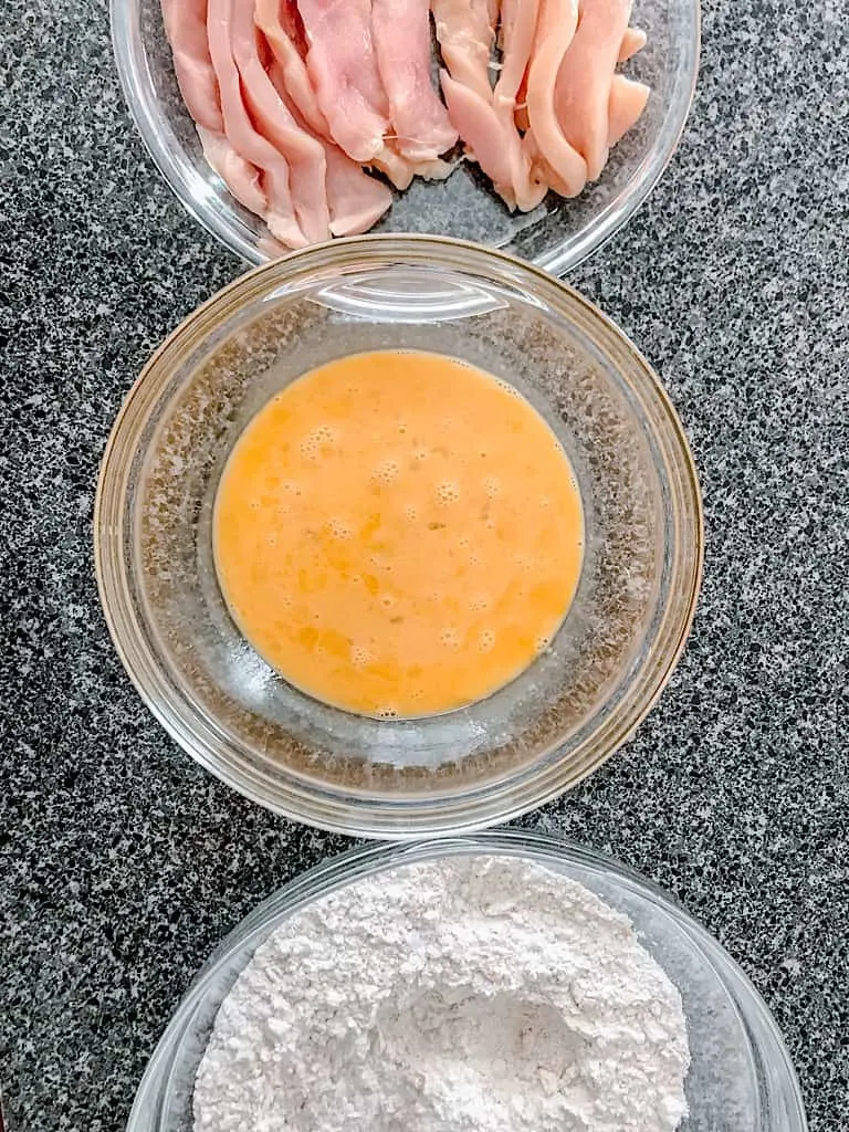 Chicken, egg wash, and flour coating for sage fried chicken