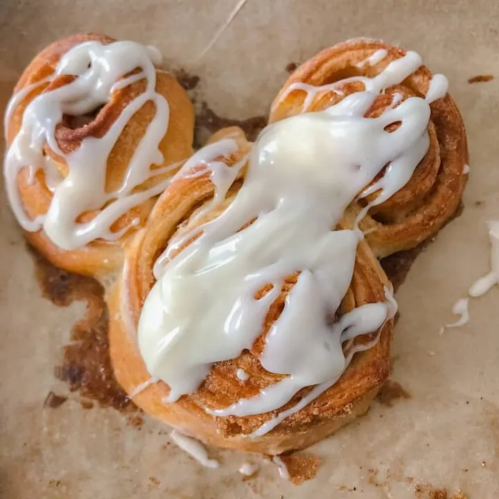 Bring a little magic into your home with this recipe for Mickey Mouse Cinnamon Roll! You will use pre-made refrigerated crescent dough to make the cutest Disney inspired breakfast or treat! 