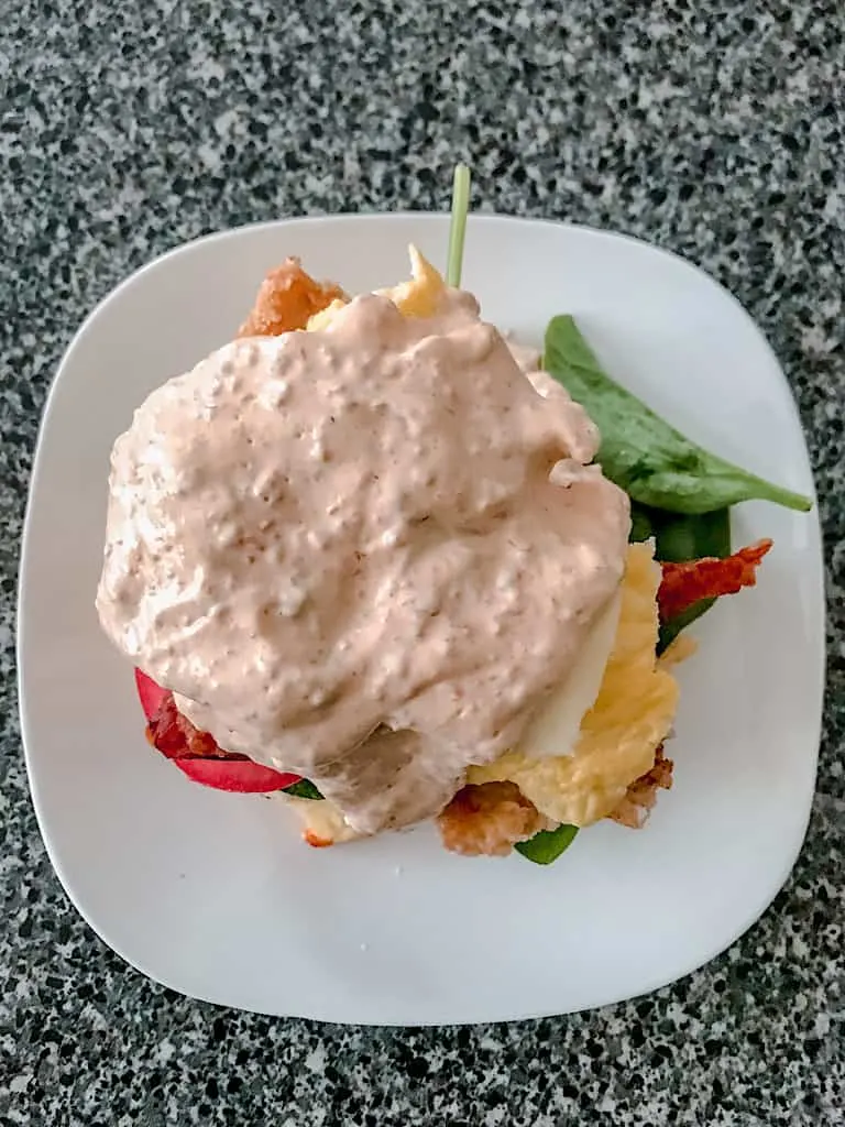 Creamy chipotle sauce over fried chicken Benedict