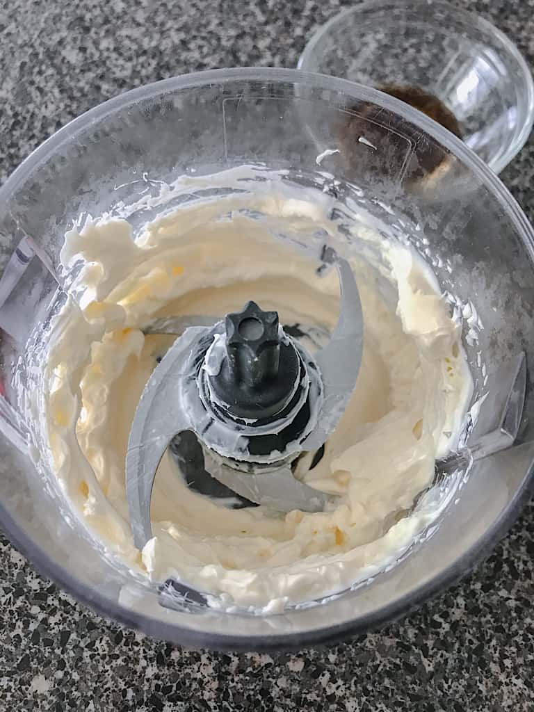 Beat the softened cream cheese with a hand mixer or in a food processor.