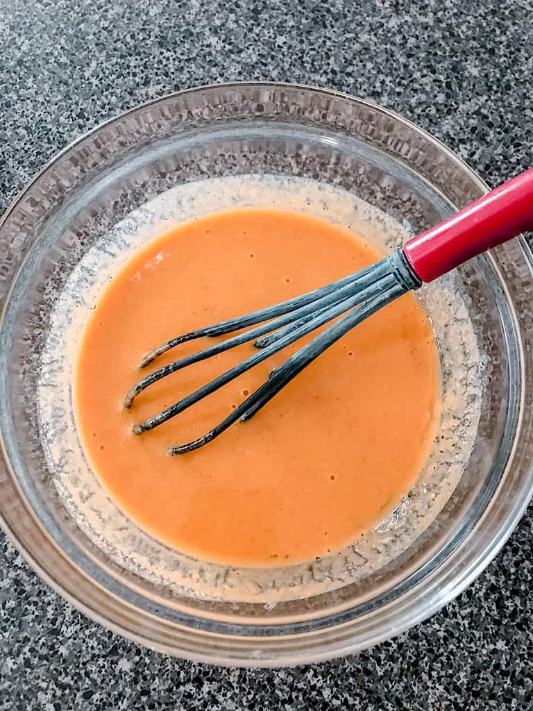 In a separate mixing bowl, use a whisk to combine the milk, oil, vinegar, and pumpkin puree.