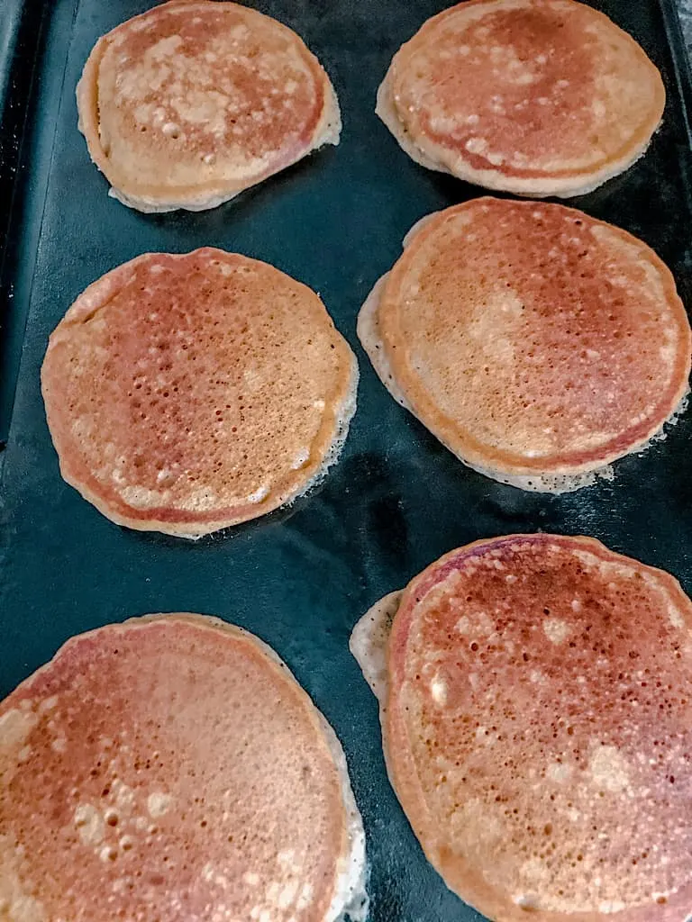When the pancakes begin to bubble, flip them over and cook the other side for 2-3 minutes.