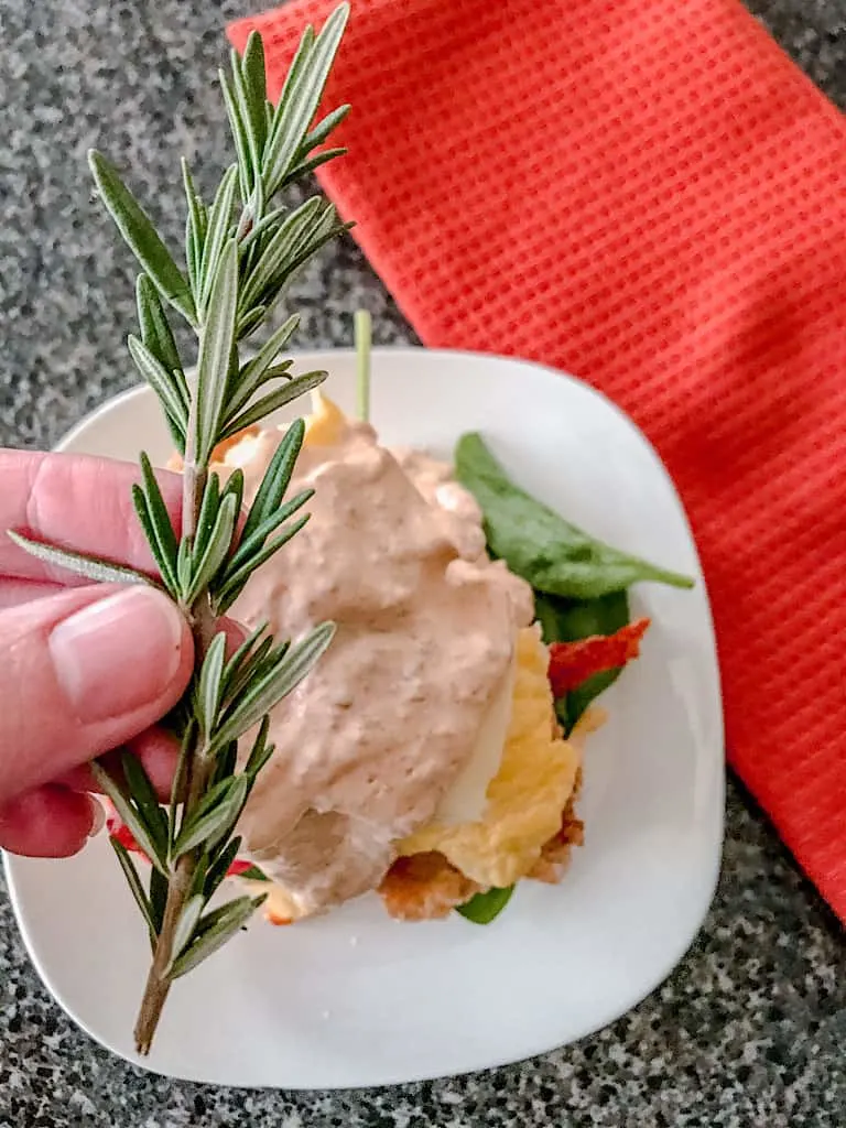 If you want to take your Fried Chicken Benedict to the next level, add a sprig of fresh Rosemary to the top. It makes it look and feel like you are eating at Hash House A Go Go!