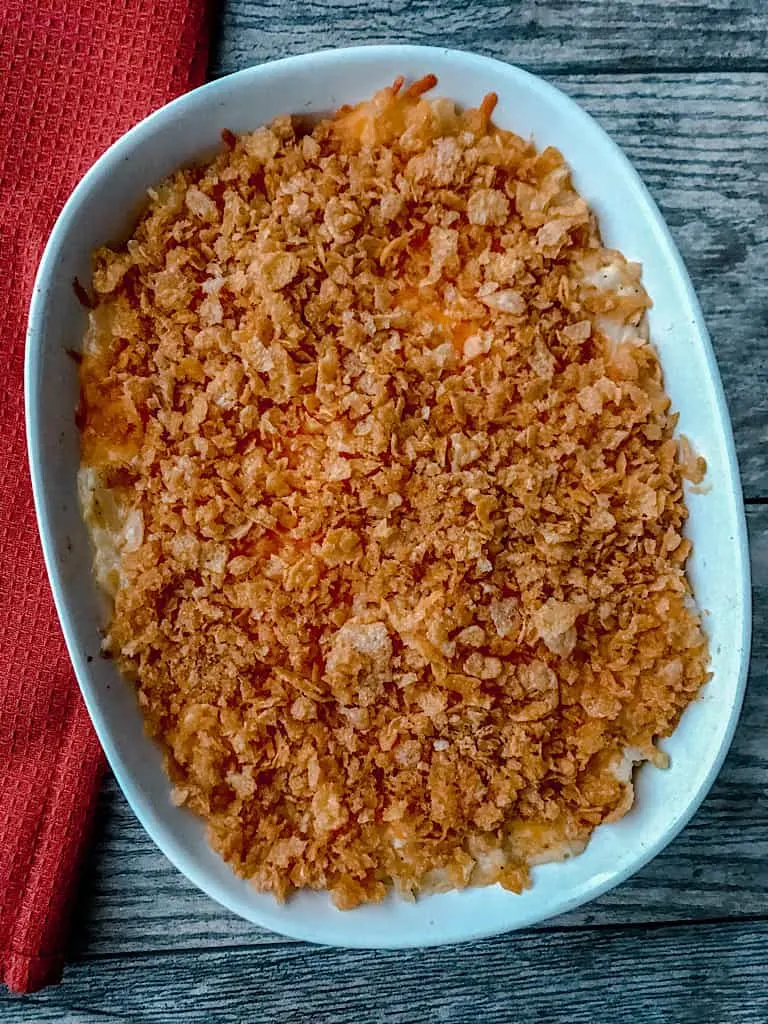 A pan of three cheese funeral potatoes with cornflakes