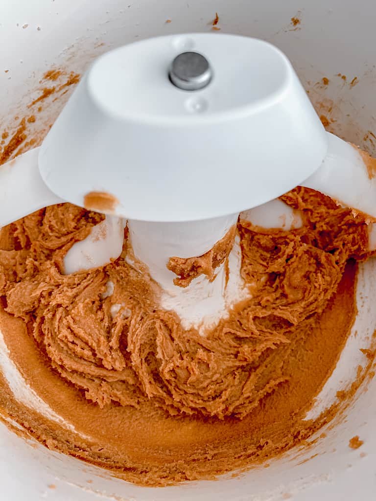 In the bowl of a stand mixer, add the butter, cookie butter, sugar, and brown sugar. Beat together until light and fluffy.
