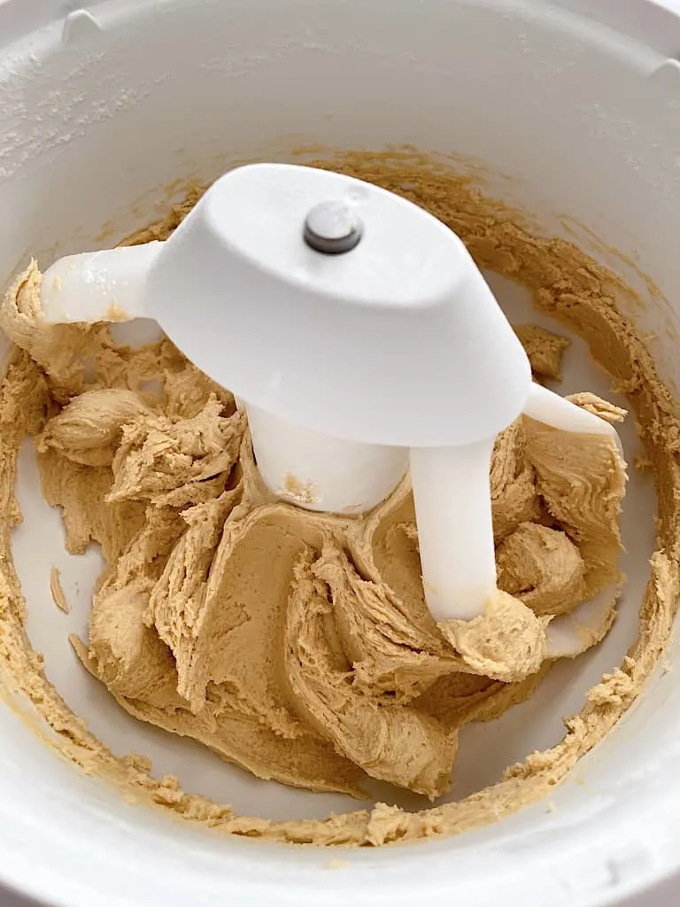 Add the flour, cornstarch, baking soda, and salt and mix for about 1 minute, until cookie dough begins to form.