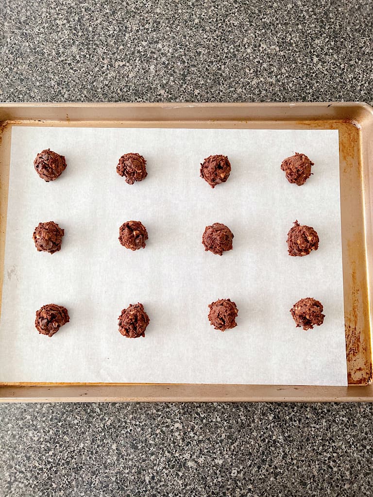 Use a cookie scoop (I used a 1 tablespoon scoop) to scoop out mounds of dough onto a parchment lined baking sheet.