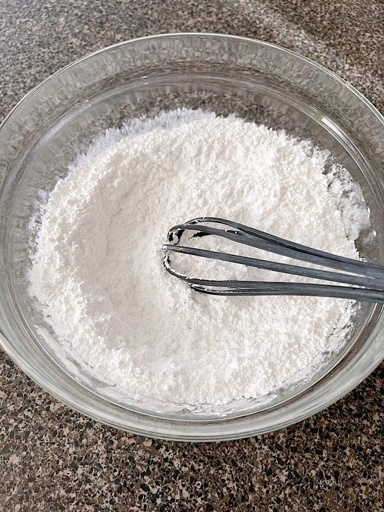 Whisk together the powdered sugar and nutmeg.