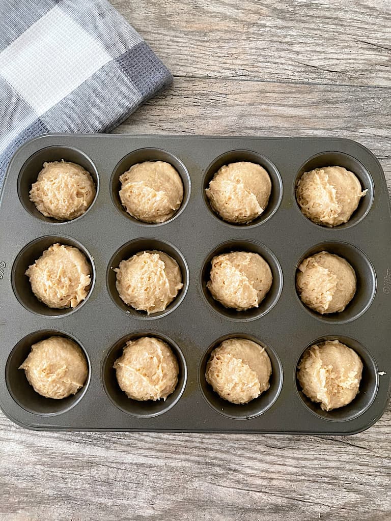 Line a muffin pan with liners or spray with nonstick spray.  Add 1/4 cup of batter to each cup.