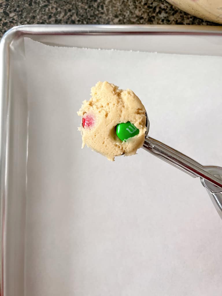Use a cookie scoop (mine held 1 Tablespoon of dough) and arrange the cookies on a parchment paper lined baking sheet or plate.