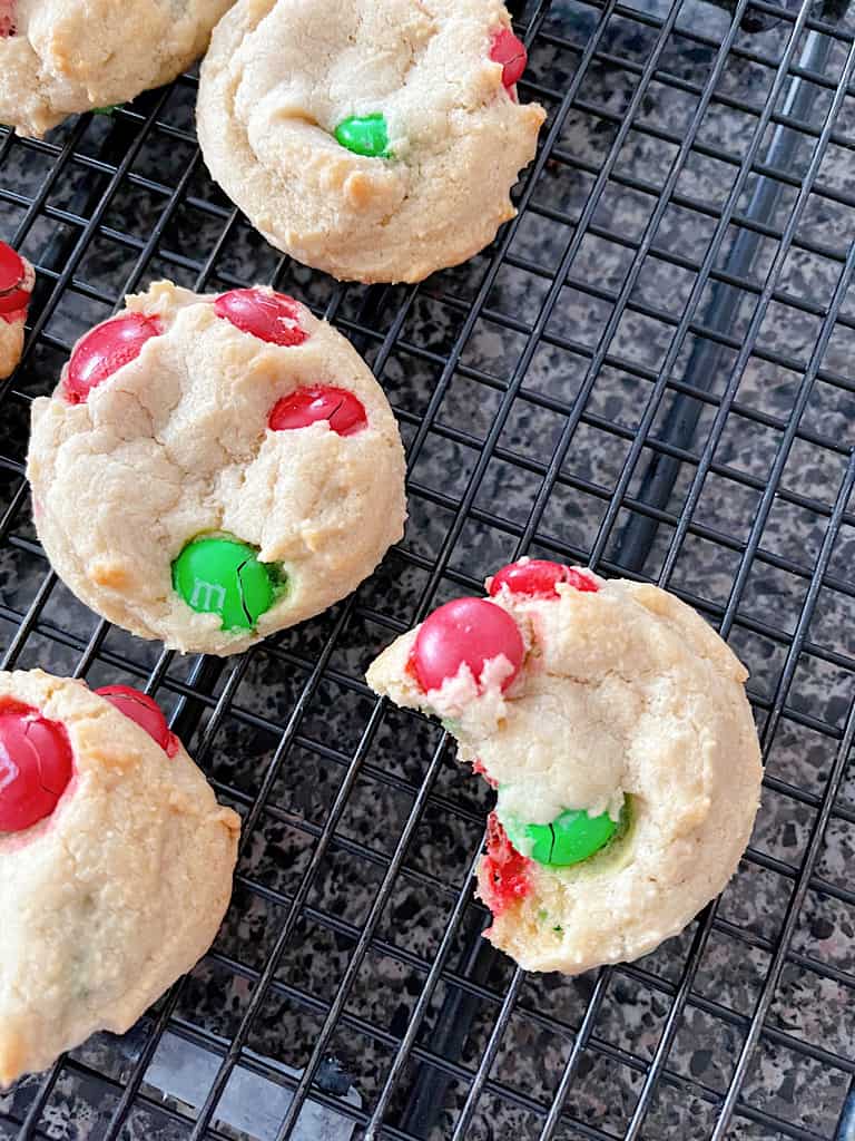 Cream Cheese Cookies with M&Ms on a cooling rack