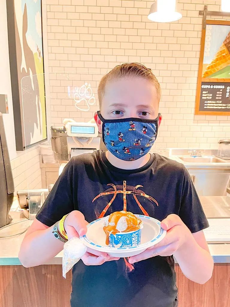 A child wearing a mask at Great Wolf Lodge during COVID