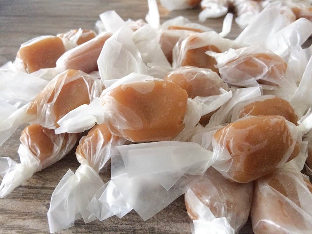 Homemade caramels made in the microwave and wrapped in wax paper
