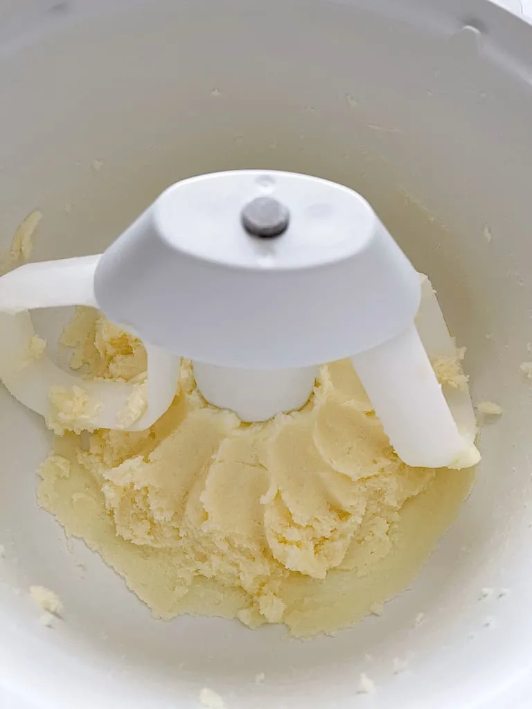 Cream the softened butter and sugar in the bowl of a stand mixer.