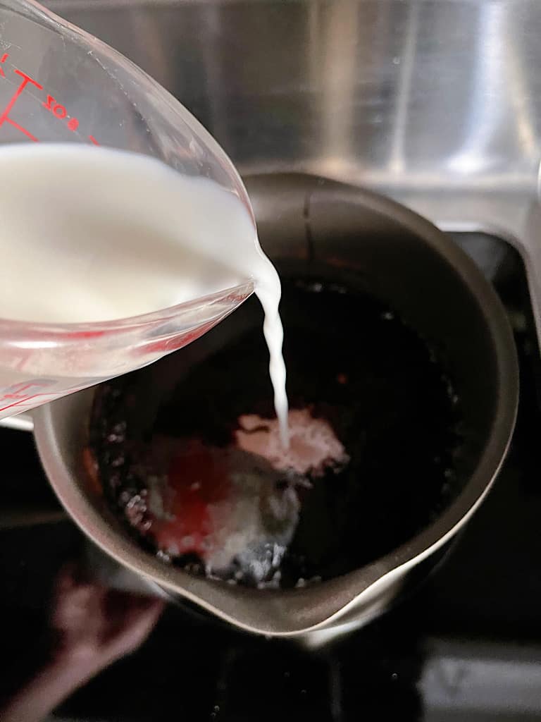 Add in the milk and allow to warm back up, but do not boil.