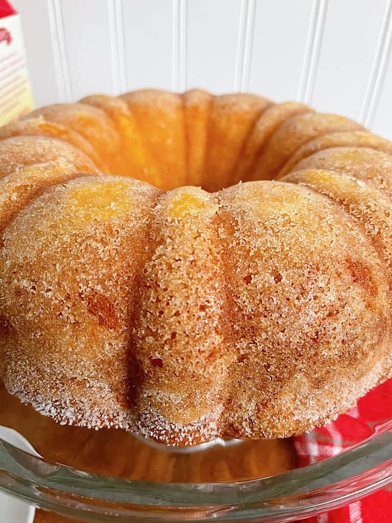 An eggnog bundt cake on a cake plate