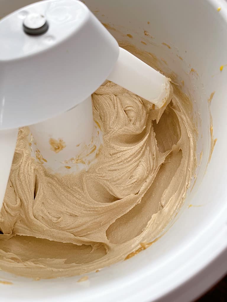 In the bowl of a stand mixer, cream together the butter, cream cheese, brown sugar, and sugar until light and fluffy.