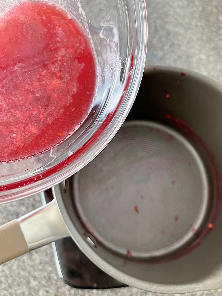 Return the raspberry juice to the pan, and add the remaining water and sugar.