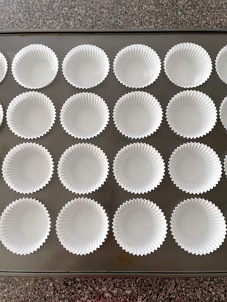 Place cupcake liners in a muffin pan.