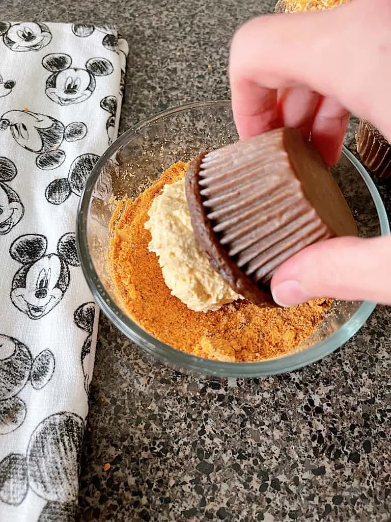 Carefully cover the frosting in candy bar crumbs.