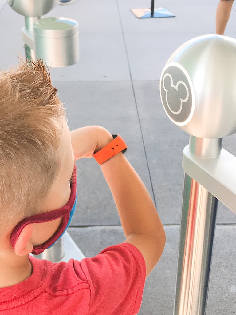 A boy entering Disney's Magic Kingdom Park